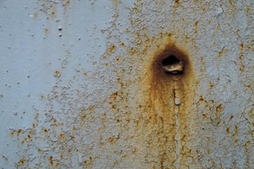 Old rusty metal hole