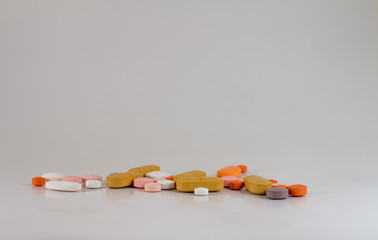 Drugs in the form of pills of different sizes, shapes and colors.