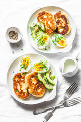 Served brunch table - potato scones and boiled eggs on a light background, top view. Delicious breakfast, snack, appetizer