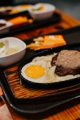 Beefsteak and fried egg as breakfast