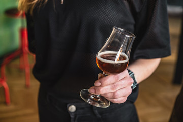 young women toasting with beer