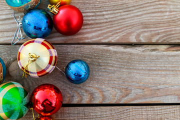Christmas baubles on wooden background. Top view, copy space