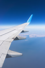 Fototapeta na wymiar Flight over blue sea
