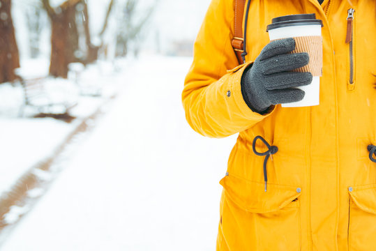 Woman Holding Cup Of Coffee Outside In Winter Day