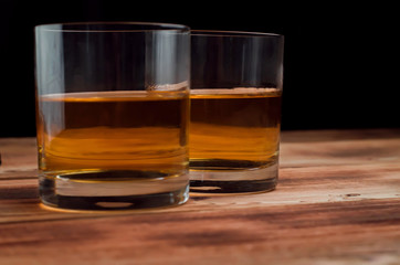 Glasses for whiskey on a wooden table
