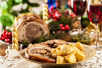 Traditional italian porchetta on festive table