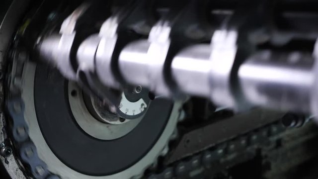 Rotation of printing machine parts in a typography. Professional printing machine in the printing house.