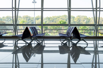 Rows chair with glass window at terminal gate
