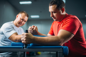 Two arm wrestlers fighting on their hands