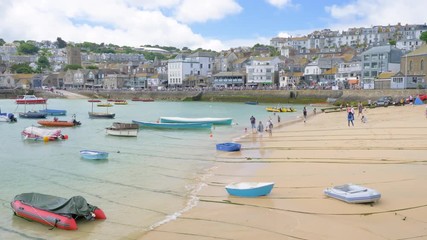 Tourists enjoying the summer on the beach in St Ives, Cornwall.
