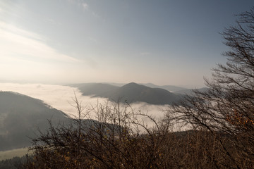 autumn mountain landscape with mist on valleys, mountain ranges and blue sky in Slovakia