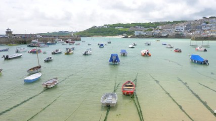 Boats moored in beautiful St Ives harbour in Cornwall, England.