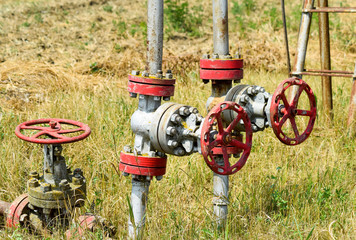 Manual shut-off valve on oil well. Oil well wellhead equipment