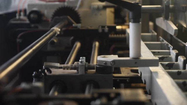Detail of a professional printing press in the typography. Book production in a printing house.