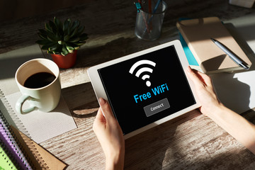 Free wifi connection on device screen. Internet and wireless technology concept.