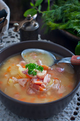 Pea soup with smoked chicken, selective focus