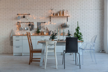 Interior light kitchen with christmas decor and tree