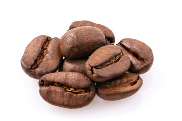 Roasted coffee beans isolated on white background. Full depth of fieldm.