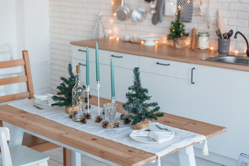 Interior light kitchen with christmas decor and tree