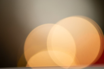 festive light illumination and light spots on a dark pastel background. Blurred background.