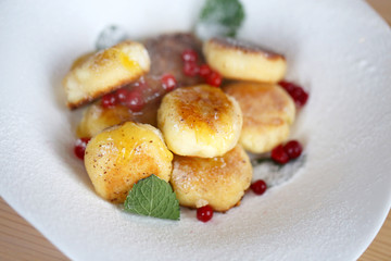 Macro photo of bright tasty cheese cakes with berries
