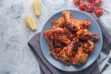 baked chicken pieces in teriyaki sauce, closeup, top view, copy space