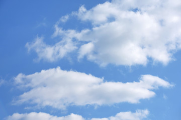Naklejka na ściany i meble Amazing blue clear sky with white puffy clouds and sunlight