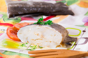 cod with tomato seasoned with parsley and oil