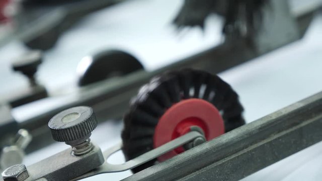 Roller rotation of professional printing machine in the printing house. Offset printing machine in typography.