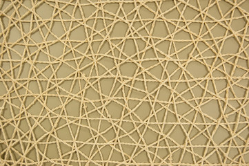 woven mesh of artificial material on olive background