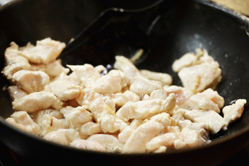 Chicken meat in a wok