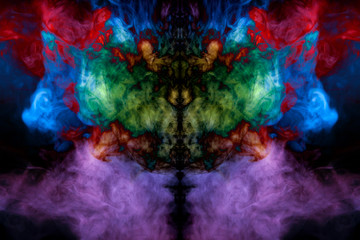 Abstract image of smoke of different colors in the form of horror in the form of the head of the face and eyes on a black isolated background. Soul and ghost in mystical form of butterfly.