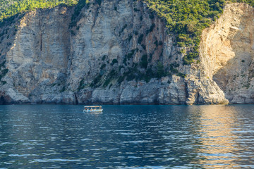 A tall, verdant green coast meets the Adriatic Sea