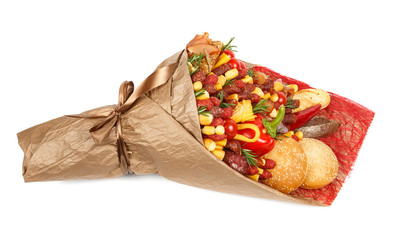 Original bouquet consisting of different varieties of sausage, meat, smoked cheese, tomatoes, pepper and bread as a gift on the white background