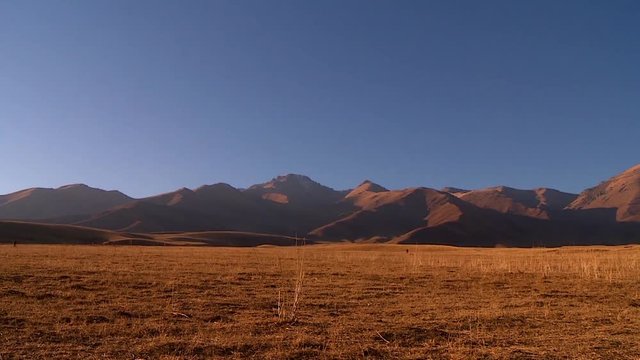 Mountains and foothills of Kazakhstan, mountain landscape, evening lighting