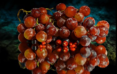 bunch of red grapes on a black background