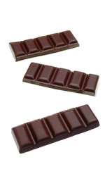 Broken or cracked dark chocolate bars, chips or pieces isolated on white background