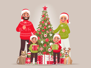 Joyful family near the New Year tree. Merry Christmas and Happy New Year