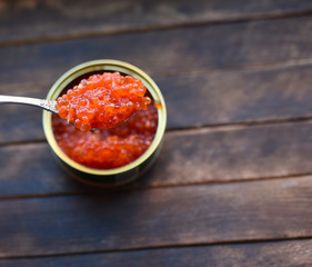 red caviar in a dessert spoon
