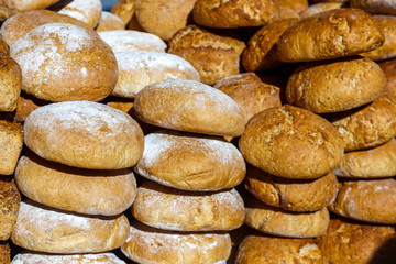 Assortment of different types of breads for sale on the market.