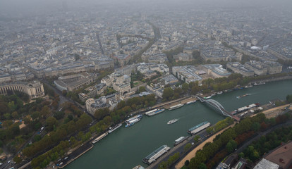 Fototapeta premium Panorama of Paris - The view from Eiffel-tower on a rainy day