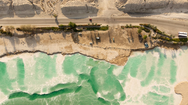 Dead sea coastline with parked car Israel