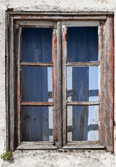 Fototapeta na wymiar old window of abandoned house in ruins