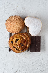 chocolate and pastries on white rustic background