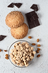 chocolate almonds and pastries on white rustic background