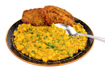 Indian tarka daal meal with onion bhaji isolated on a white background