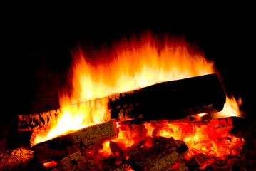 Burning wood. Fire in darkness. 