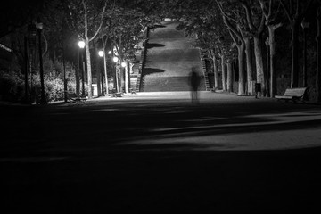 'Walk alone': Night scene in the gardens of Montjuic, Barcelona