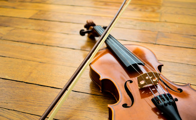 Fototapeta na wymiar Violin and bow resting on the floor. Instrument and music