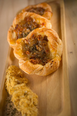 Dried shredded pork bun, Fresh homemade bakery on wooden background, selective focus